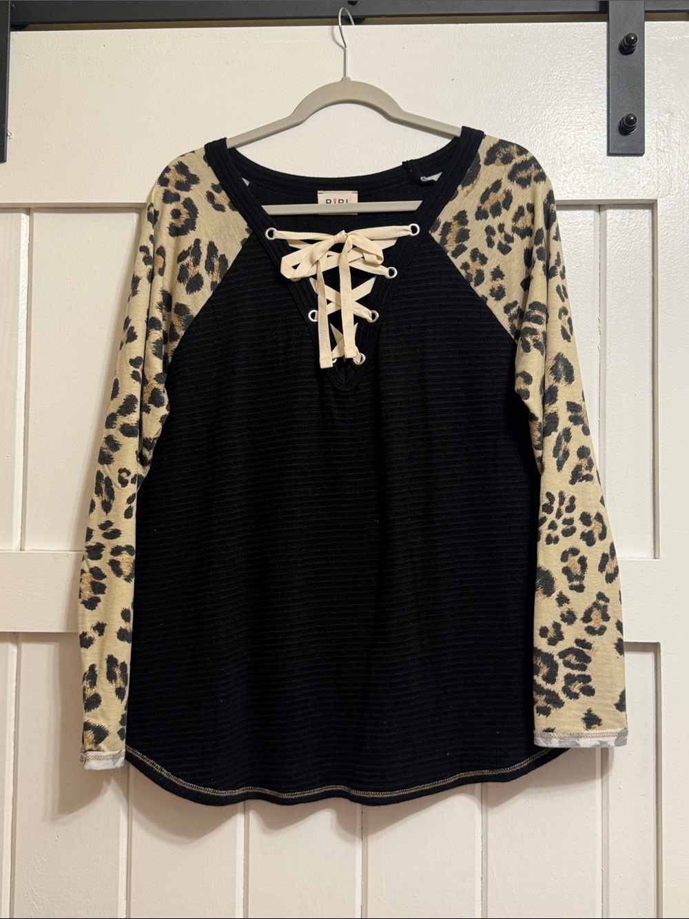 BiBi Black Top with Leopard-Print Raglan Sleeves and Cream Lace-Up